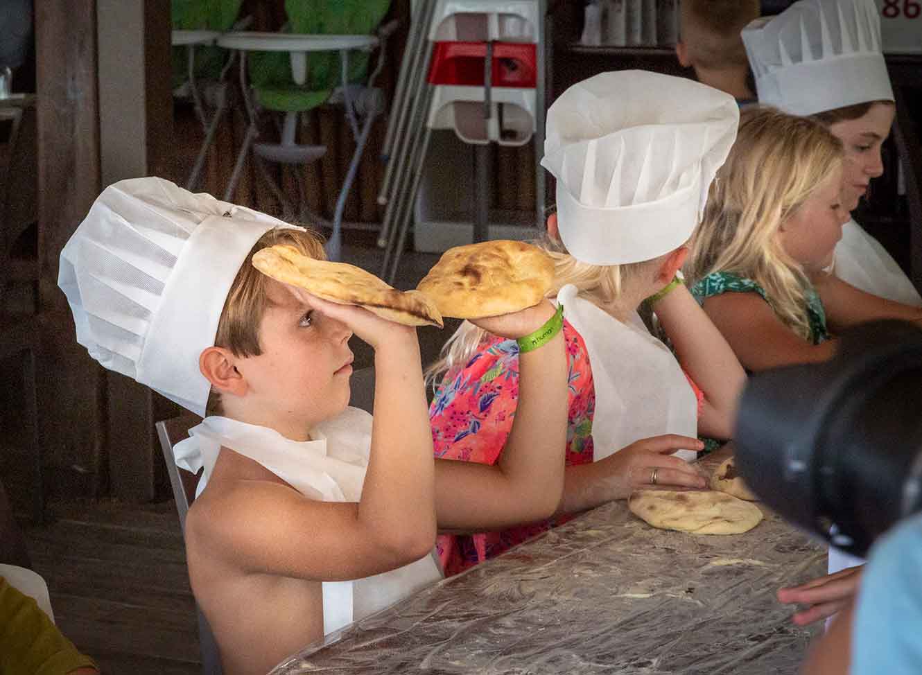 Kids learning how to make bread